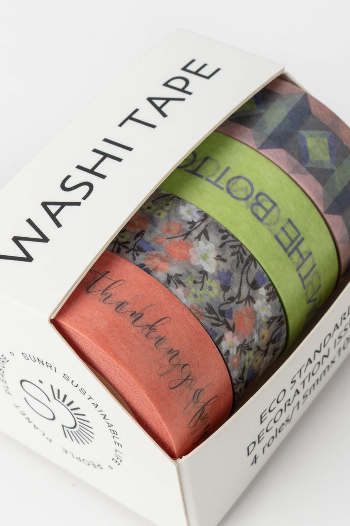 Box of washi tape with colorful designs and text on a white background