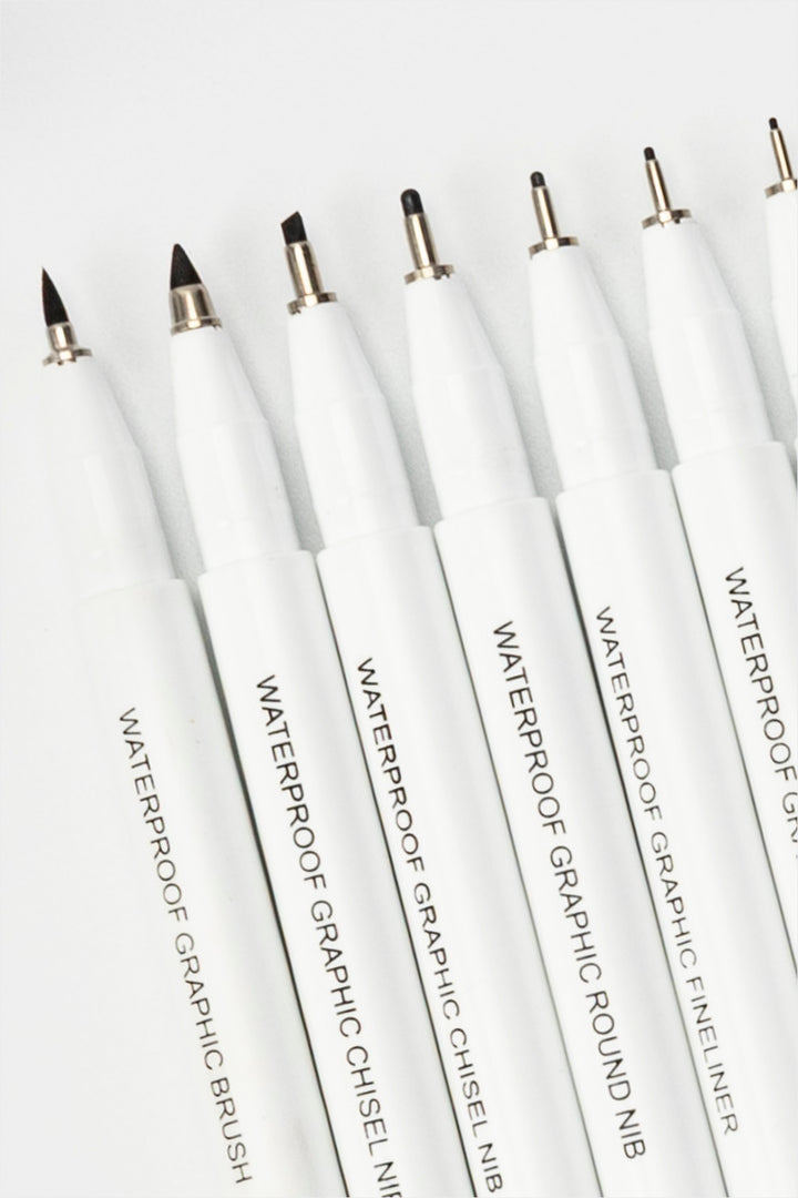 waterproof graphic pens close-up showing different nib shapes including brush, chisel and fineliner tips
