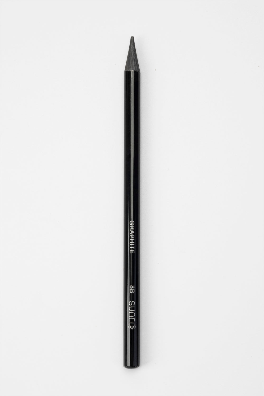 single black woodless graphite sketching pencil upright showing full length and tip
