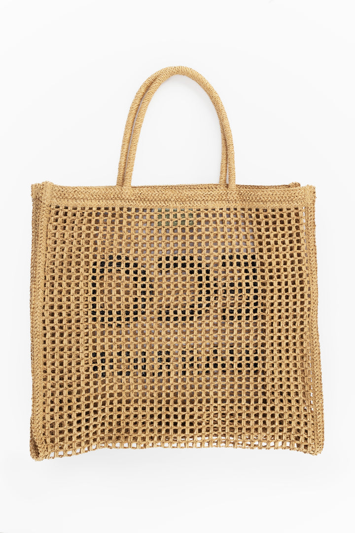 Woven beige tote bag on a white background